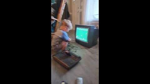 Two year old Playing Stampede on Atari