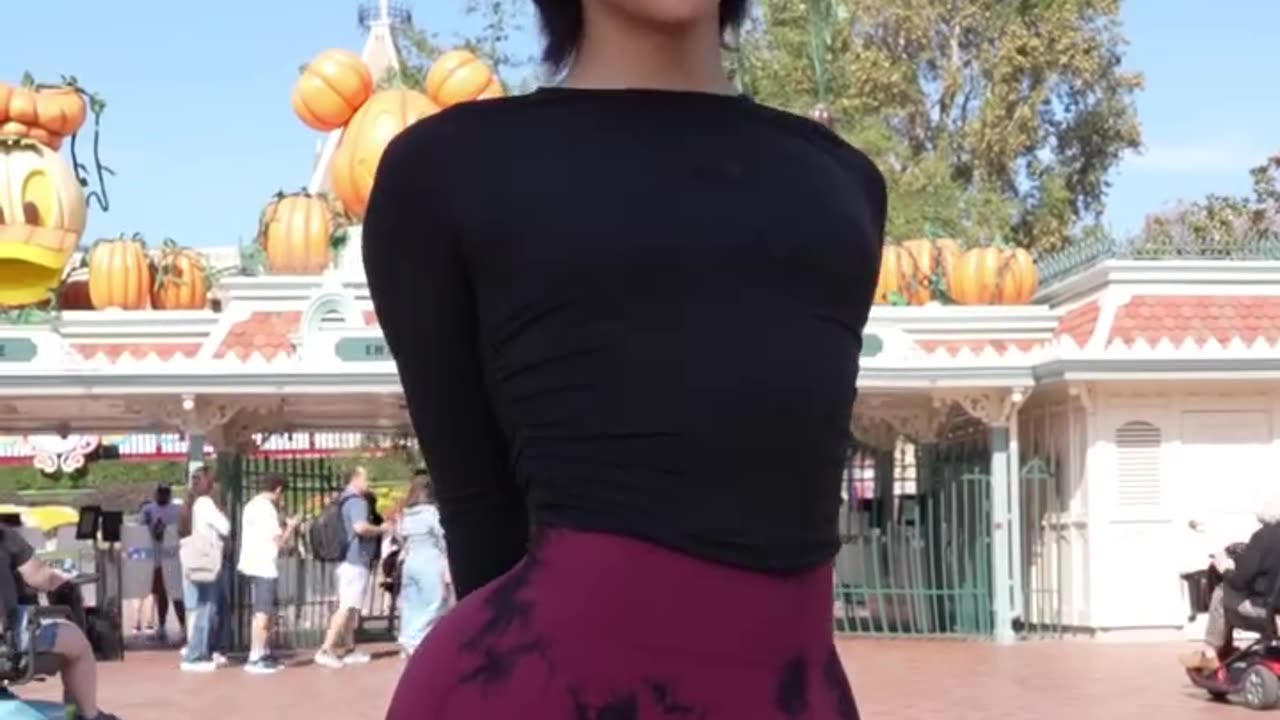 Happy tgirl in amusement park