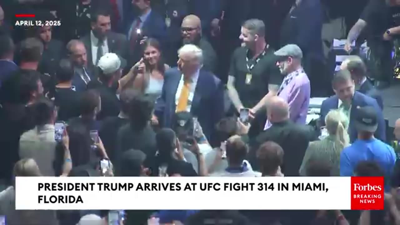 Trump and granddaughter Kai enter the UFC arena, the audience roared