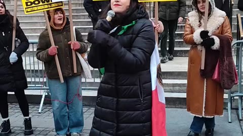 Chicana protests against Donald Trump and ICE.