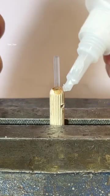 Applying Adhesive to Wooden Dowel in Vise