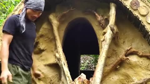 He built house hidden deep beneath a giant fallen tree root
