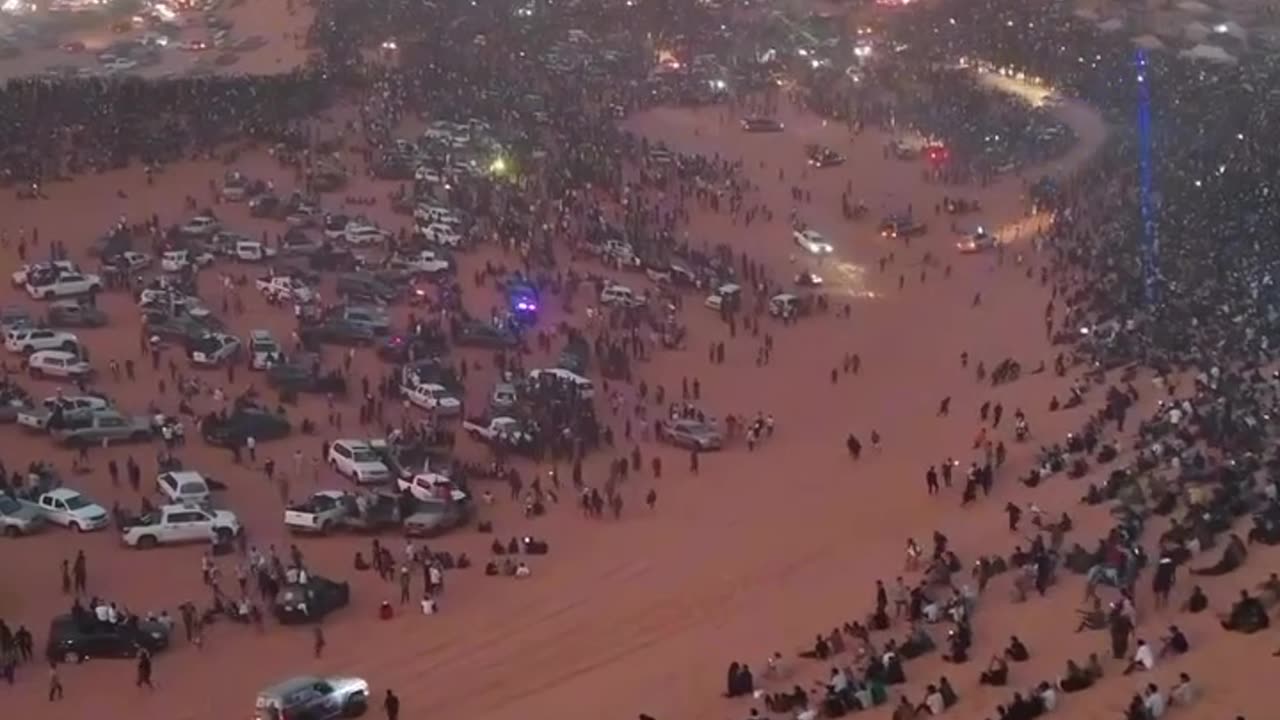 A Palestinian flag rose in the middle of the Libyan desert