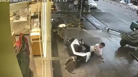 Scooter rider crashes into store glass doors