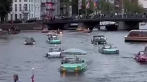 Amphibious vehicles cruise Amsterdam's canals