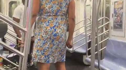 Dude wearing a dress threatens people with a knife on the NYC subway