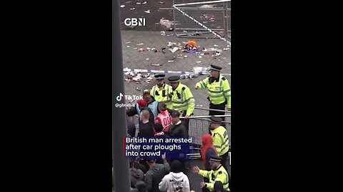 A third angle of the aftermath of a man driving through a crowd of Liverpool fans