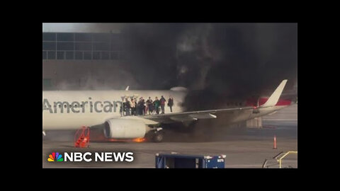 American Airlines plane catches fire at Denver International Airport