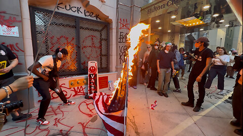 American Flag Taken Down, Set Ablaze Outside Hilton Hotel in Downtown LA