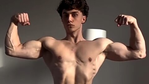 Young man flexing muscles