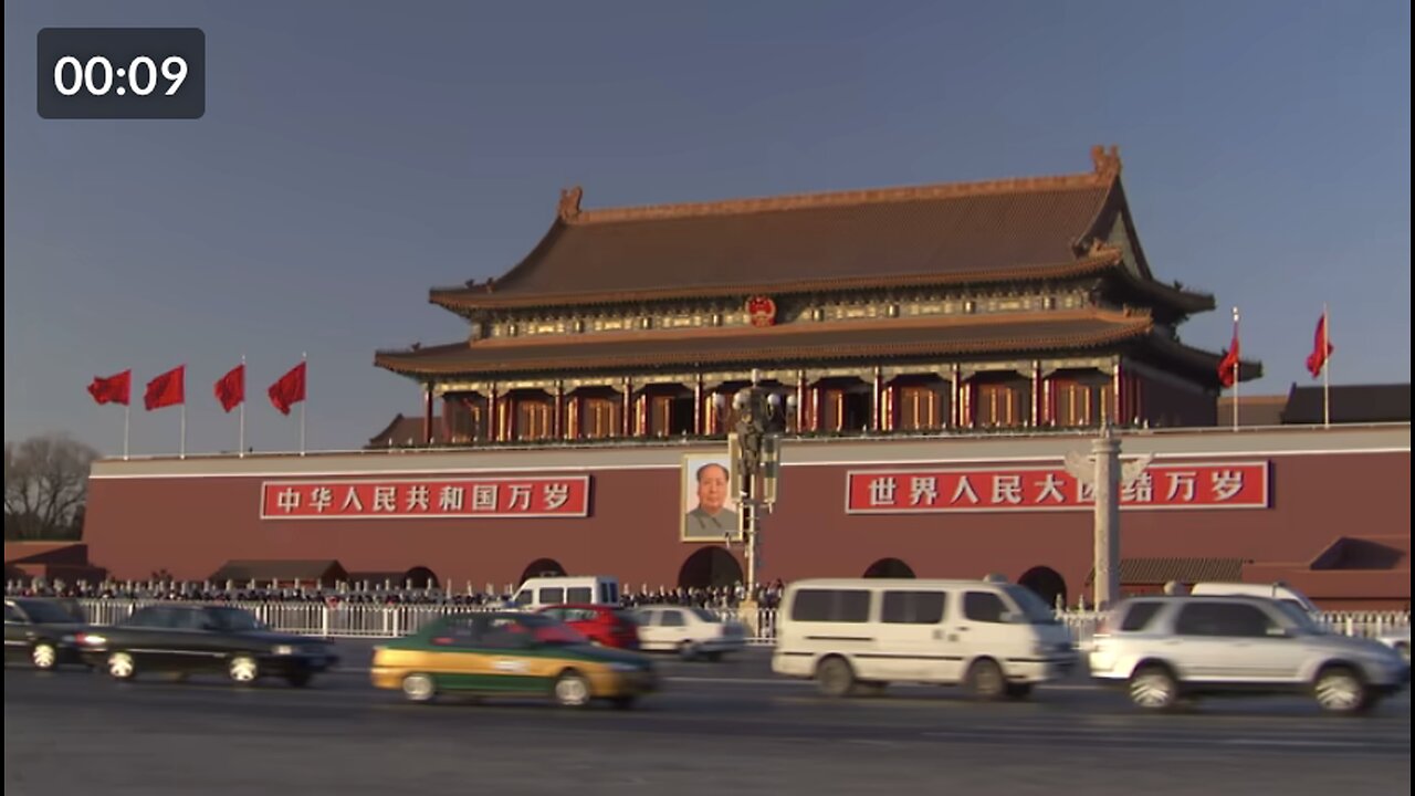 Wide Shot pan,right zoom,out , A bendy bus drives past the famous Forbidden City in Beijing, China.