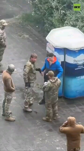 GUT PUNCH out of nowhere for Ukrainian getting his paper checked by Zelensky’s mobilization officers