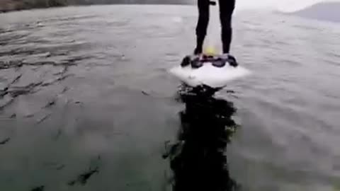 His electric hydrofoil ride turns magical as he encounters a pod of 100+ dolphins in Howe Sound.