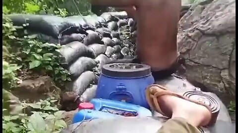 Cambodian soldier firing at Thai positions across the border