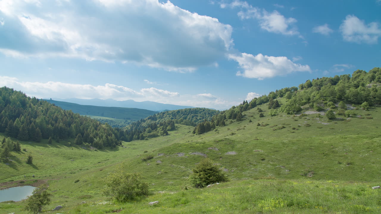 Mountain Landscape With Hills And Clouds