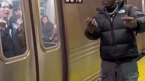 TNB in NYC Subway - stealing phone from innocent Japanese passenger and gloating