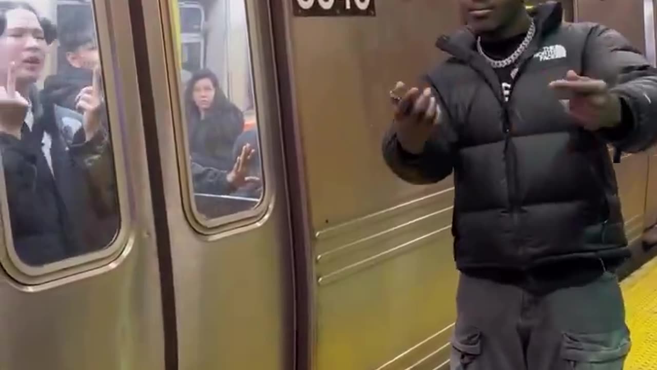 TNB in NYC Subway - stealing phone from innocent Japanese passenger and gloating
