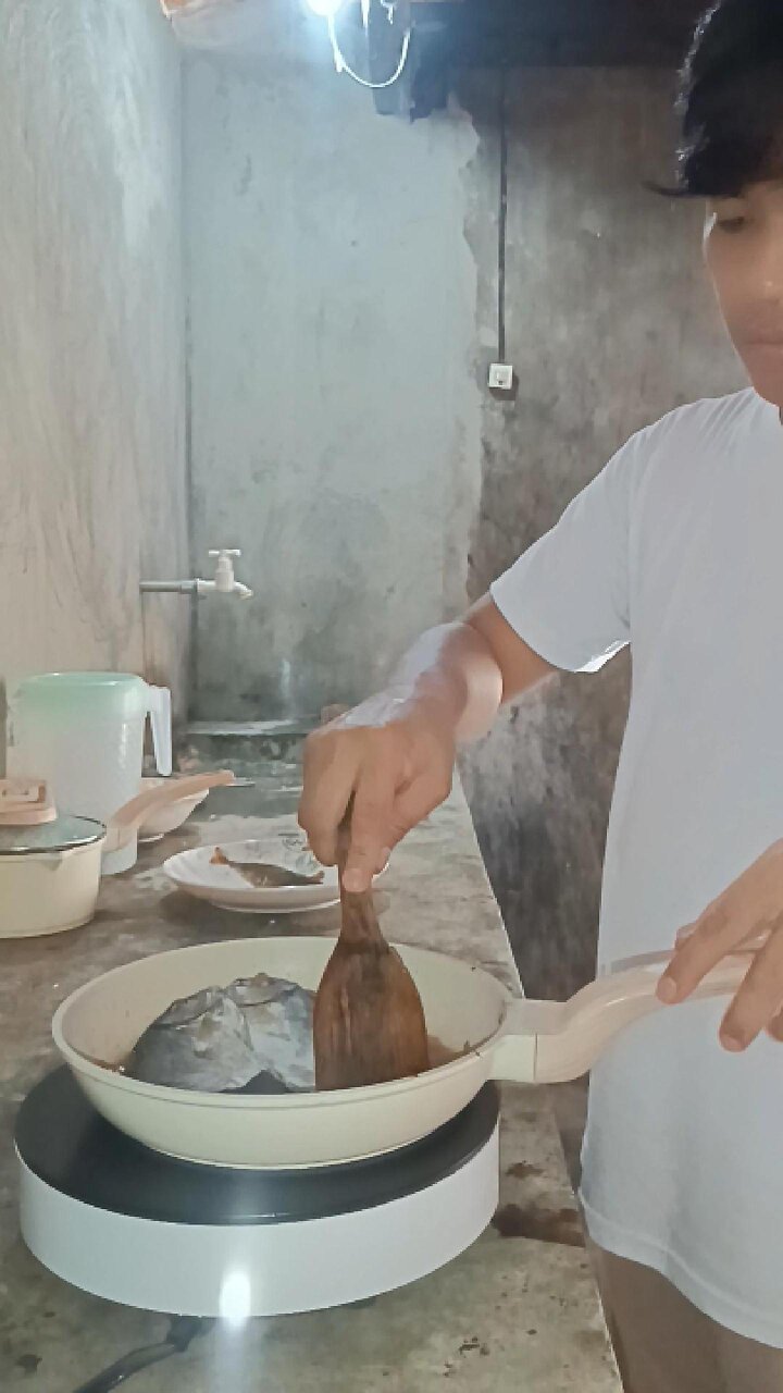 Mike Frying Dried Fish