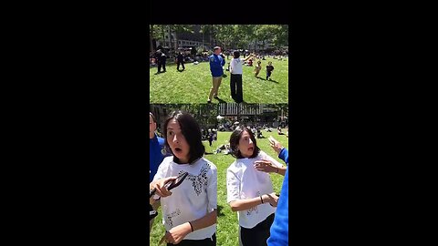 zionist woman attempts to assault a photographer in front of a police officer