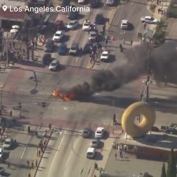Protesters can be seen waving Mexican flags in the streets