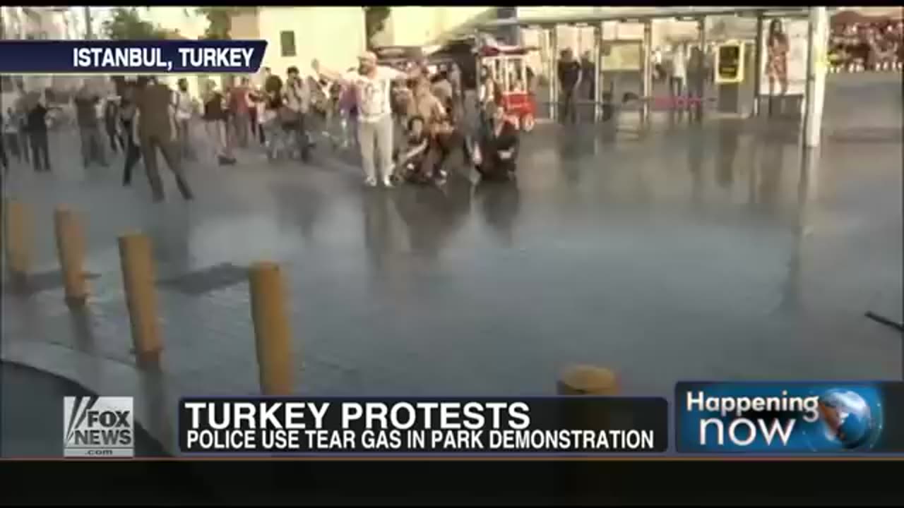 Protestor in Turkey gets air when hit with a water cannon