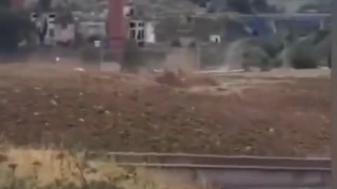Watch the shocking moment a massive mud wave crashes into Tyrnyauz, Russia