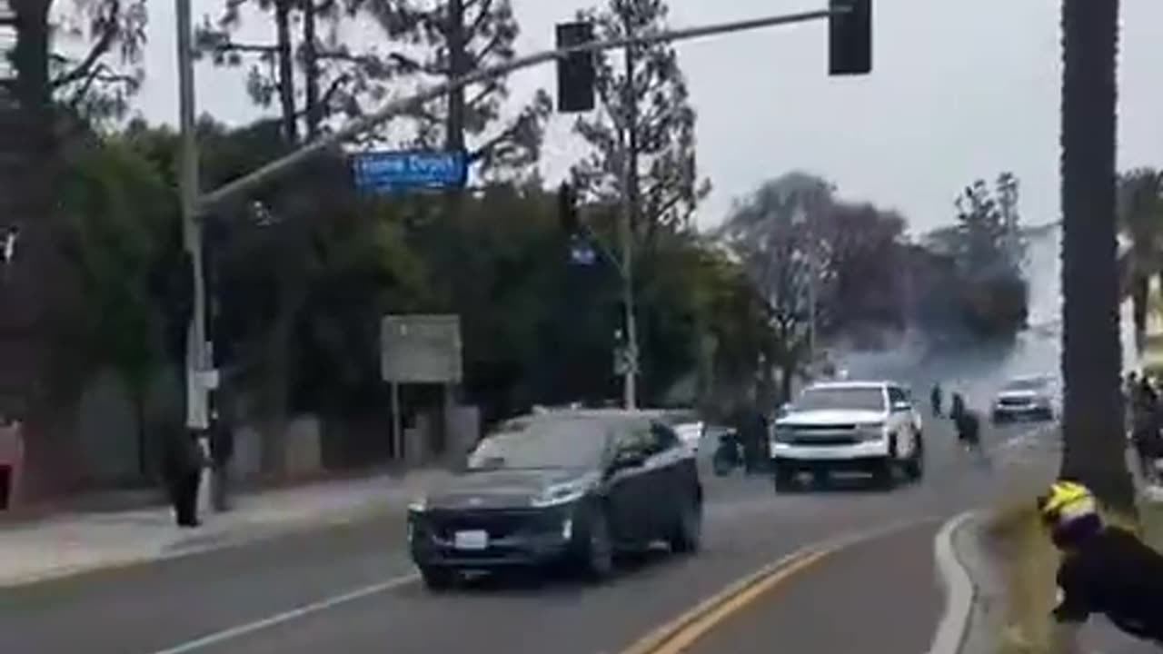 Peaceful rioter throws rocks at law enforcement