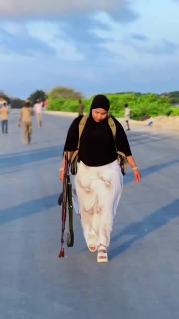 Beautiful Somalia military woman with a Gun.