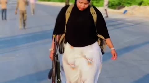 Beautiful Somalia military woman with a Gun.