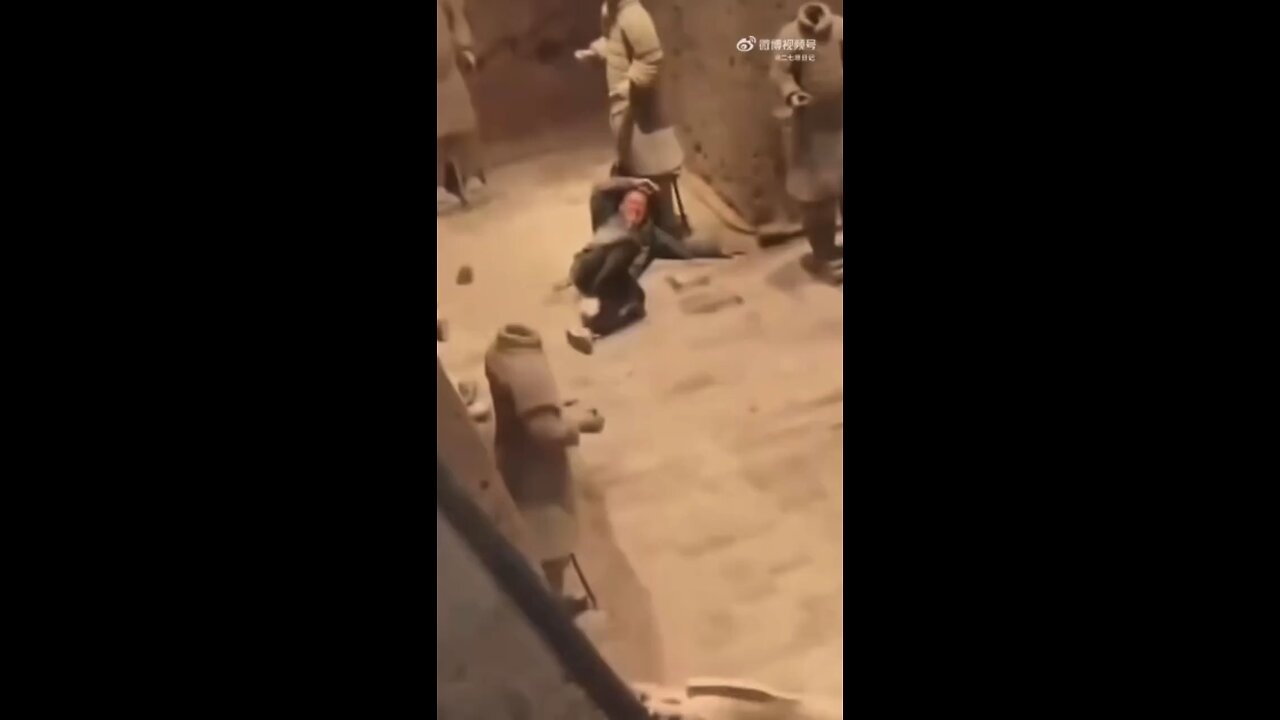 Tourist leaps 18 ft into the 2,000-year-old Terracotta Army, landing and damaging the clay warriors.