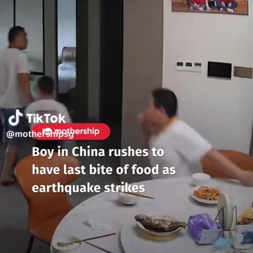 Boy in China rushes to have a last bite of food as earthquake strikes