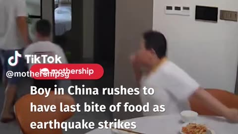 Boy in China rushes to have a last bite of food as earthquake strikes
