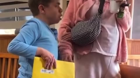 Black man tries to bully special needs person and caretaker for allegedly using racial slur