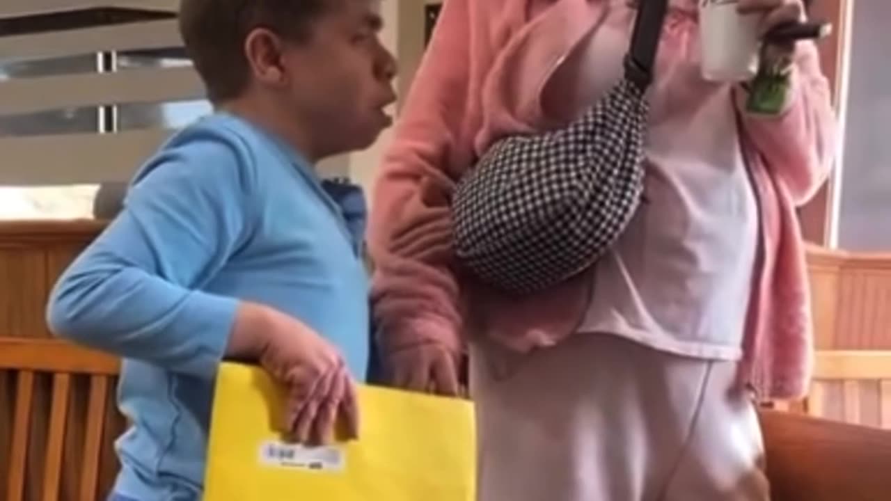 Black man tries to bully special needs person and caretaker for allegedly using racial slur