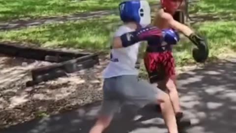 2 Kids Fight In Park With Headgear