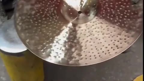 TONGXIANG HANDHAMMERING THE CYMBALS