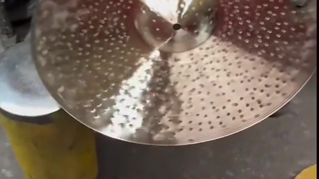 TONGXIANG HANDHAMMERING THE CYMBALS