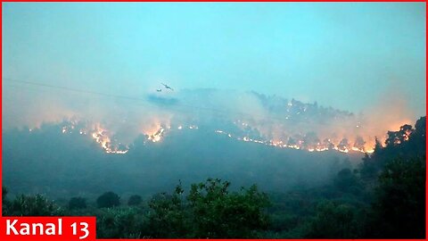 Fierce forest fires rage in south of France： Planes try to put out the flames