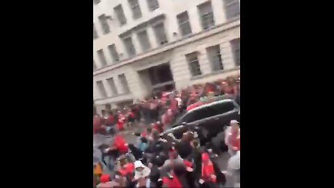 Different angle of the car driving through a Liverpool parade celebration