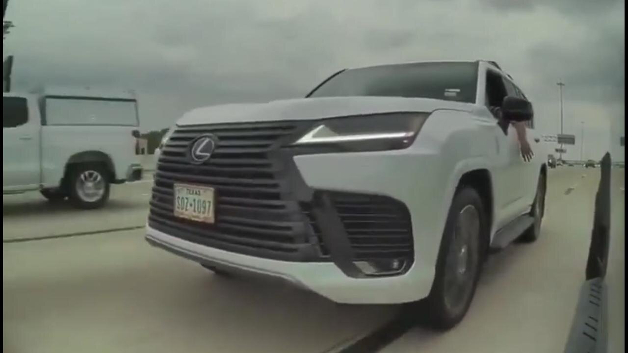 LEFTIST Lexus pulled up beside Tesla Cybertruck wielding, a holstered gun (?) at the driver