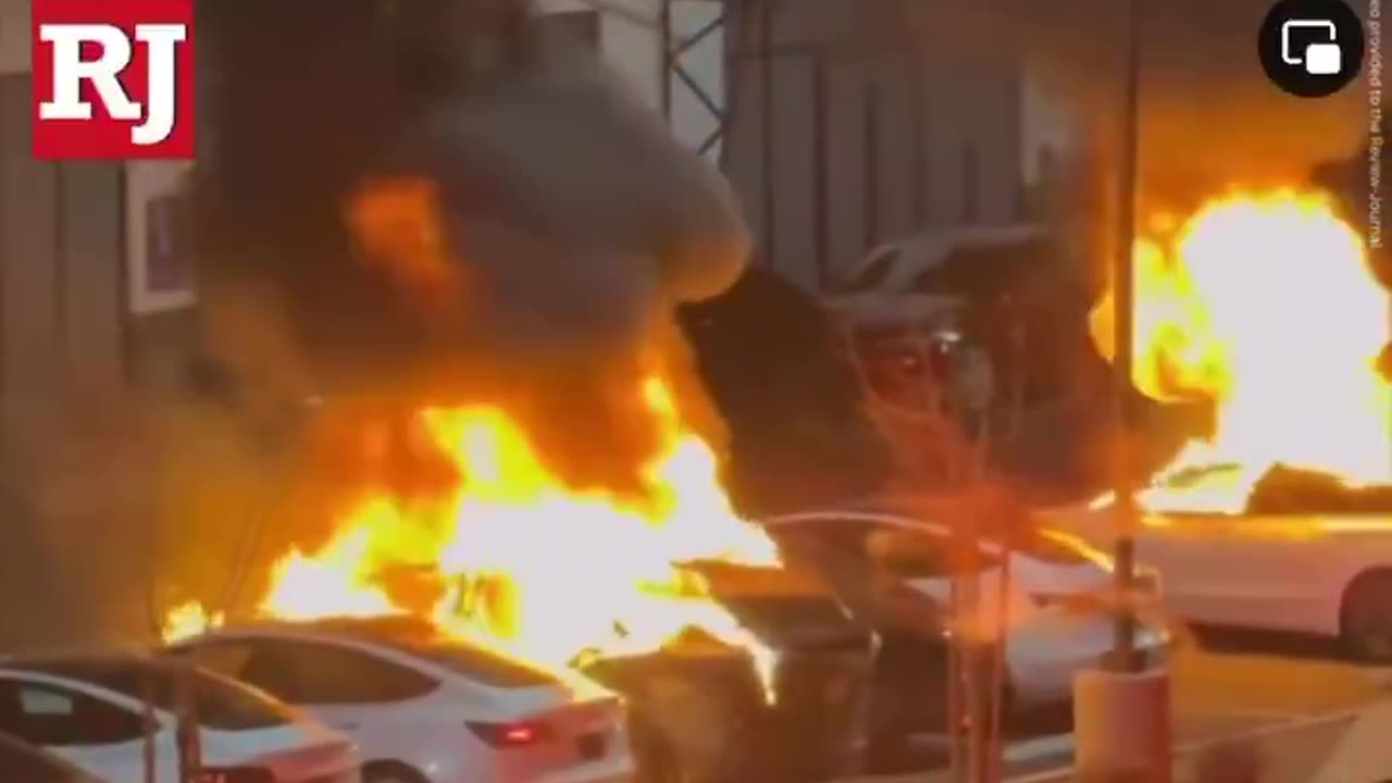 Authorities say multiple cars were set on fire at a Tesla service center in Las Vegas