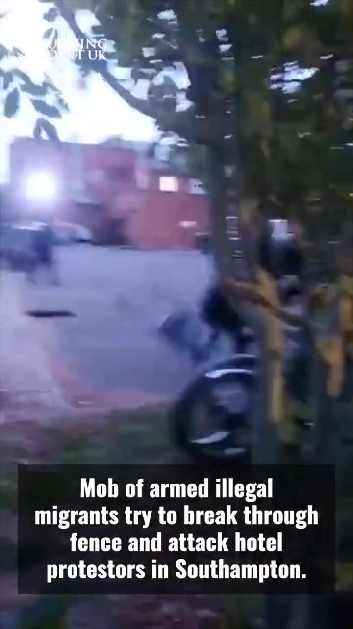 A mob of armed illegal migrants hurled missiles and tried to break through the fence