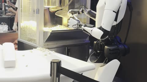 Tesla Diner - Optimus robot serves popcorn at Tesla's new diner