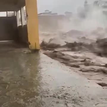 The moment a building collapsed as raging floodwaters took their toll in Swat,