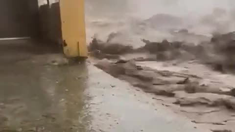 The moment a building collapsed as raging floodwaters took their toll in Swat,