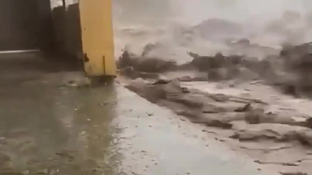 The moment a building collapsed as raging floodwaters took their toll in Swat,