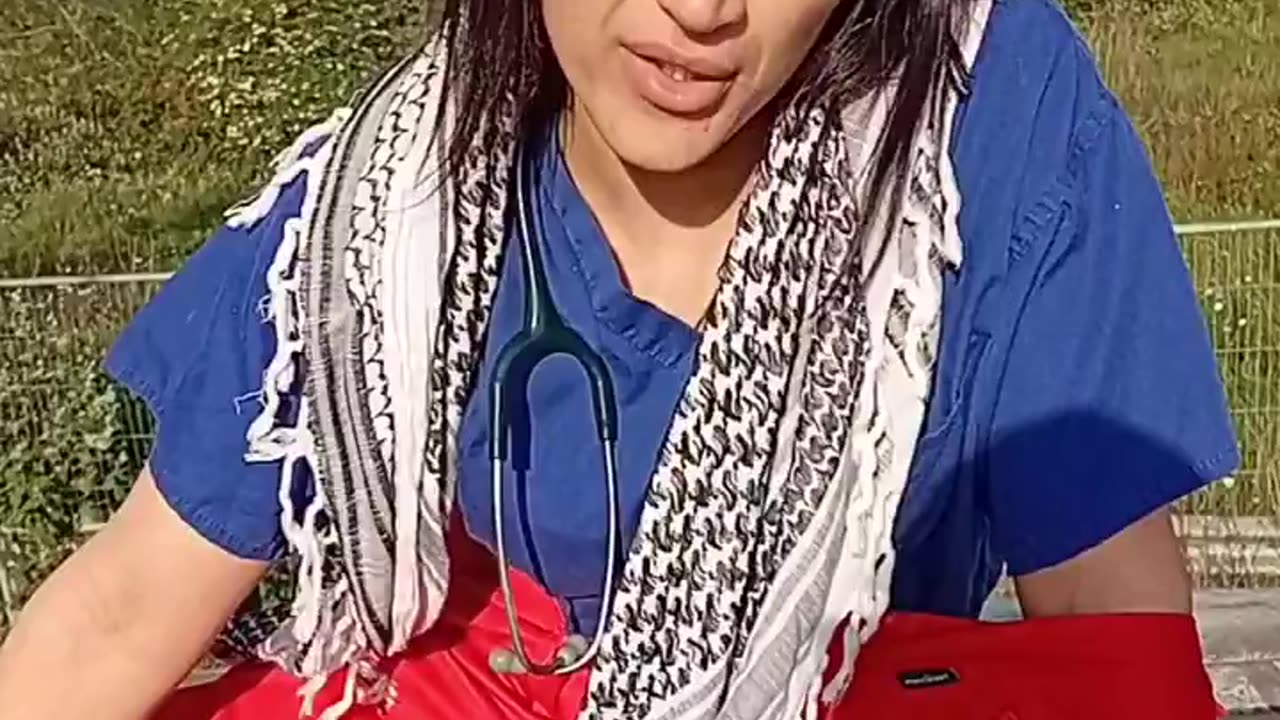 A terror supporter doctor in the UK sitting on top of an ambulance blocking a factory