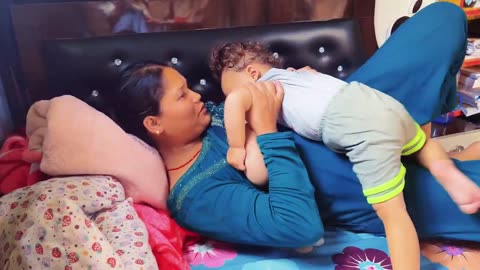 Breastfeeding Asian mother for educational purposes 