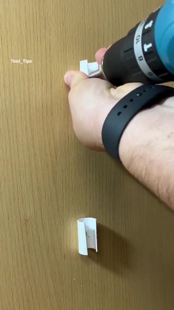 Electric Drill Boring into Concrete Wall