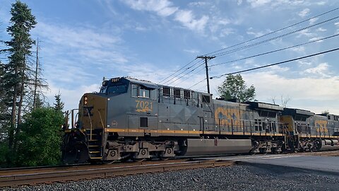 CSX Trains 7021 and 7586 head East